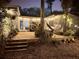 Enchanting backyard with string lights, wooden deck and a cozy hammock for relaxing outdoors at 430 S Virginia Ave, Sanford, FL 32771
