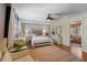 Bright and airy bedroom with hardwood floors, a vanity, and neutral decor for a tranquil retreat at 430 S Virginia Ave, Sanford, FL 32771