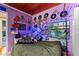 Funky bedroom with vinyl records, plants, and neon lighting. The walls are decorated with records at 430 S Virginia Ave, Sanford, FL 32771