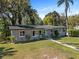 Charming single-story home with tidy landscaping and a quaint walkway leading to the front door at 430 S Virginia Ave, Sanford, FL 32771