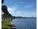 Scenic lake view with a concrete barrier and palm trees along the shoreline at 430 S Virginia Ave, Sanford, FL 32771