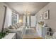 Inviting living room boasts natural light, hardwood floors, comfortable seating, and elegant decor at 430 S Virginia Ave, Sanford, FL 32771