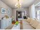 Charming living room featuring natural light, hardwood floors, comfortable seating, and elegant decor at 430 S Virginia Ave, Sanford, FL 32771