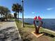 Park with a sculpture of two birds on a heart near the lake at 430 S Virginia Ave, Sanford, FL 32771