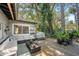 Outdoor patio with comfortable seating, a table, a grill, and plenty of greenery at 430 S Virginia Ave, Sanford, FL 32771