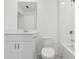 Bathroom featuring a tub-shower combination, white sink and toilet, and vanity with storage at 4332 Ranch House Rd, St Cloud, FL 34772