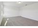 Spacious bedroom featuring soft neutral carpet, a ceiling light, and a closet for storage at 4332 Ranch House Rd, St Cloud, FL 34772