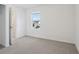 Bedroom with carpet, natural light from a window, closet door and white walls at 4332 Ranch House Rd, St Cloud, FL 34772