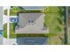 Aerial view of home with defined property lines showcases the roof, lawn and driveway at 4475 Casablanca Ave, Kissimmee, FL 34746