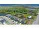 Aerial view of a neighborhood adjacent to nature, showing a mix of homes, green spaces, and nearby amenities at 4475 Casablanca Ave, Kissimmee, FL 34746