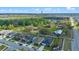 Overhead view of a neighborhood displays tree coverage and nearby roadways at 4475 Casablanca Ave, Kissimmee, FL 34746