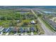 Areal view of a residential area close to green spaces, featuring an orderly street layout and well-kept yards at 4475 Casablanca Ave, Kissimmee, FL 34746