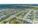 An aerial view of a neighborhood, showcasing the organized street layout and proximity to natural spaces and local roadways at 4475 Casablanca Ave, Kissimmee, FL 34746
