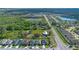 Aerial view of a neighborhood with houses positioned near green area; the homes are well-maintained and uniformly designed at 4475 Casablanca Ave, Kissimmee, FL 34746