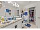 Bathroom with double vanity, granite countertops, and a separate water closet at 4475 Casablanca Ave, Kissimmee, FL 34746