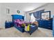 Stylish bedroom with blue accents, including a tufted bed and dresser set at 4475 Casablanca Ave, Kissimmee, FL 34746