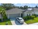 Well maintained home with neat landscaping, two car garage and a car parked in the driveway at 4475 Casablanca Ave, Kissimmee, FL 34746