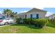 Well maintained home with manicured landscaping and two car garage with car parked in the driveway at 4475 Casablanca Ave, Kissimmee, FL 34746