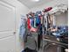 Functional laundry room with modern washer and dryer units and ample storage space at 4475 Casablanca Ave, Kissimmee, FL 34746