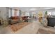 Spacious living room with view of dining area, large sectional sofa and tiled flooring at 4475 Casablanca Ave, Kissimmee, FL 34746