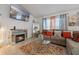 Beautiful living room with decorative fireplace, large mirror, stylish décor and modern fixtures at 4475 Casablanca Ave, Kissimmee, FL 34746