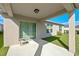 Covered patio area with sliding glass doors and an overhead light fixture at 4475 Casablanca Ave, Kissimmee, FL 34746