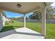 Covered patio with backyard view offers a peaceful outdoor living space at 4475 Casablanca Ave, Kissimmee, FL 34746