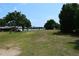 A lovely property view with a grassy lawn and a view of the water at 4654 Thornlea Rd, Orlando, FL 32817