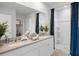 Bright bathroom featuring a double sink vanity and an enclosed shower with modern fixtures at 487 Taylor Groves Dr, Lake Wales, FL 33898