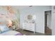 Charming bedroom featuring mermaid wall art, white furniture, and a cozy ambiance at 487 Taylor Groves Dr, Lake Wales, FL 33898