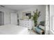 Primary bedroom features a stylish dresser and an accent chair with pillows at 487 Taylor Groves Dr, Lake Wales, FL 33898