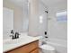 Bathroom with a wood vanity and modern fixtures at 604 Coral Trace Blvd, Edgewater, FL 32132