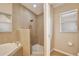 Elegant bathroom with shower and soaking tub at 604 Coral Trace Blvd, Edgewater, FL 32132
