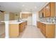 Functional kitchen featuring wood cabinets, tile backsplash, and stainless steel appliances at 604 Coral Trace Blvd, Edgewater, FL 32132