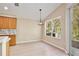 Bright kitchen nook features tile flooring, neutral walls, and a window with natural light at 604 Coral Trace Blvd, Edgewater, FL 32132
