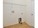 A bright laundry room with tile floor and white walls has lots of storage at 604 Coral Trace Blvd, Edgewater, FL 32132