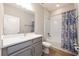 Well-lit bathroom with a gray vanity, a shower-tub combination, and modern fixtures at 706 Hyperion Dr, Debary, FL 32713