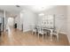 Elegant dining room with a glass-top table and stylish china cabinet at 706 Hyperion Dr, Debary, FL 32713