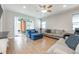 Cozy living room with sliding glass doors leading to an outdoor patio at 706 Hyperion Dr, Debary, FL 32713