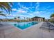 Community pool with plenty of seating, lounge chairs, and covered pavilion area at 706 Hyperion Dr, Debary, FL 32713