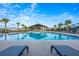 Sparkling community pool with poolside lounge chairs and a covered pavilion at 706 Hyperion Dr, Debary, FL 32713