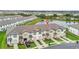 Aerial view of townhomes by a pond, showcasing location and nearby community at 730 Longboat Dr, Davenport, FL 33896