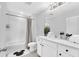 Bright bathroom featuring a shower-tub combo, ample counter space, and Mickey Mouse decor at 730 Longboat Dr, Davenport, FL 33896