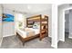 Comfortable bedroom with a wooden bunk bed, plush carpet, and mounted TV at 730 Longboat Dr, Davenport, FL 33896