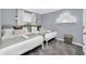 Cozy bedroom features two twin beds, soft lighting, and unique Disney-themed decor at 730 Longboat Dr, Davenport, FL 33896
