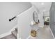 Stylish entryway with a floating shelf, mirror, and modern design elements at 730 Longboat Dr, Davenport, FL 33896