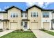 Inviting two-story townhome with a well-manicured lawn, offering curb appeal and comfortable Gathering living at 730 Longboat Dr, Davenport, FL 33896