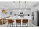 Bright kitchen boasts a quartz island with stylish seating and stainless appliances at 730 Longboat Dr, Davenport, FL 33896