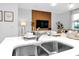 Close-up of a kitchen island with a double sink, quartz countertops, and modern fixtures and décor at 730 Longboat Dr, Davenport, FL 33896