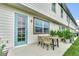 Cozy patio space featuring outdoor dining set, ideal for enjoying al fresco meals and outdoor living at 730 Longboat Dr, Davenport, FL 33896